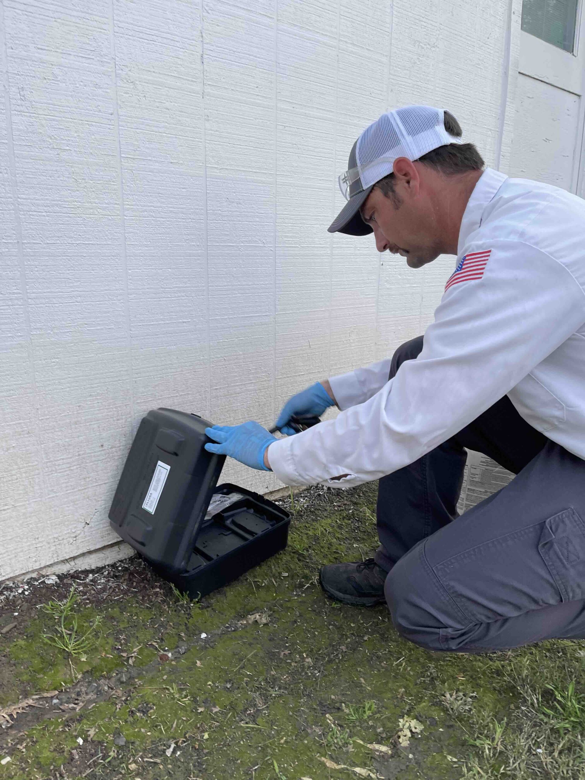 Pest Control Checking a Rodent Bait Station
